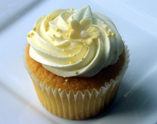 Vanilla cupcake topped with a swirl of buttercream