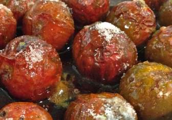 Whole roasted tomatoes glazed with olive oil